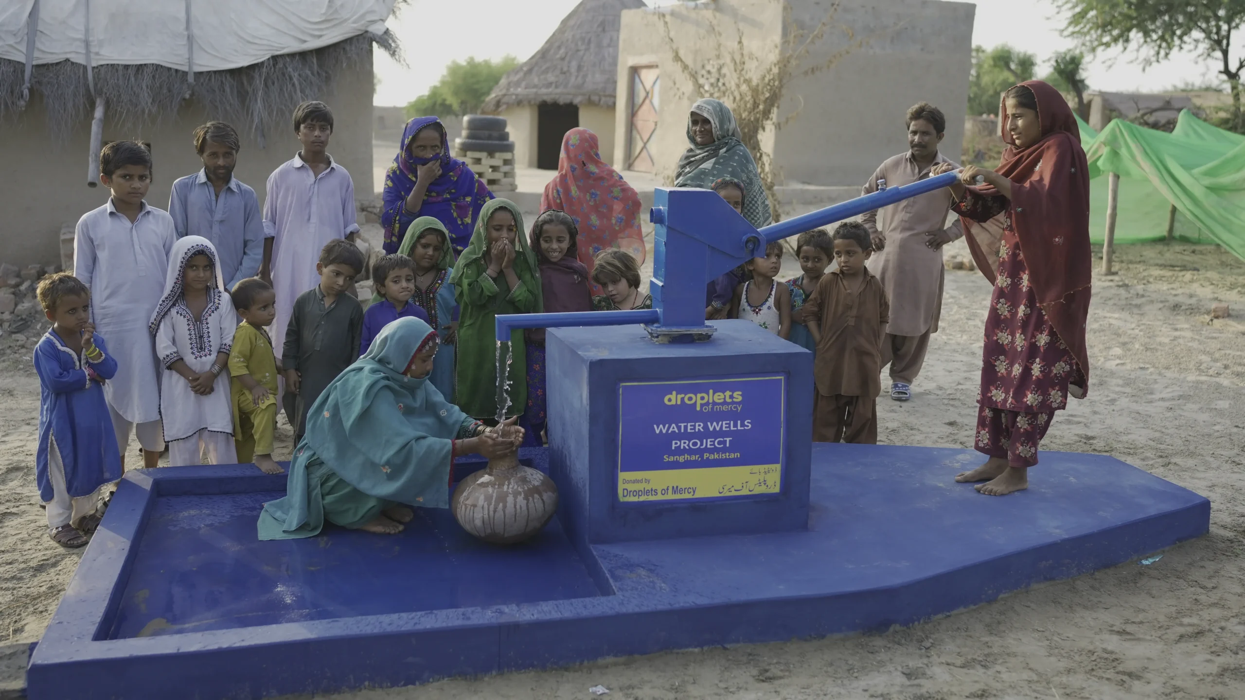A whole village gathers at their new water well